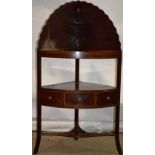 A Sheraton mahogany corner washstand, inlaid stringing, the pierced top with a cover, the splash