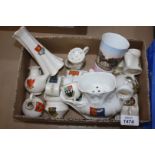 A large quantity of commemorative Goss china including a hat pin stand, small cheese dishes,