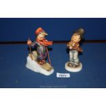 Two Hummel figures - a boy skier, and a boy blowing a trumpet (second as found,