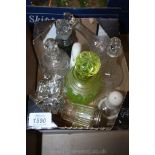 A quantity of various glass perfume and condiment jars including; Uranium glass, etc.