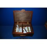 A two compartment wooden Box with approximately 10 individually wrapped and cased Havana and King