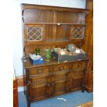 An Old Charm/Priory Oak style Oak Dresser having three doors and three drawers to the base,