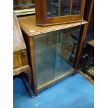 A 1950's Mahogany sliding glass doored floor cabinet, 26'' wide x 17'' deep x 32'' high.