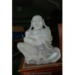 An Eastern hardstone carving of a monk.