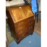 A reproduction cross-banded Mahogany Bureau,