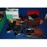A quantity of vintage cameras and audio.