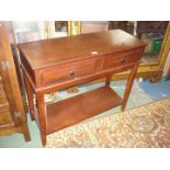 A Mahogany finished hall Side Table having two frieze drawers and lower shelf,