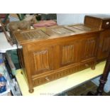 A Priory Oak type blanket Chest having linen-fold detail to the three panels at the front and the