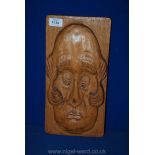 A carved wooden plaque signed by Jim Esplin, entitled 'Fly on Head'.