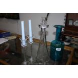 A modern hand blown glass candlestick, blue glass bottle and pair of spiral stemmed candlesticks.