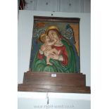 A Northern European Madonna and child, painted plater mounted on a wooden altarpiece.
