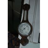A banjo wall barometer.