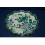 A Large Famille Verte Oriental Porcelain Charger with Pie Crust Rim Hand Painted with Figures