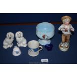 A Continental porcelain figure of a Boy with ice cream, a pair of small mantle spaniels,
