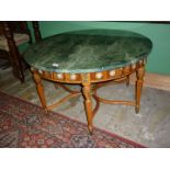 A circular Continental design veined green marble topped occasional Table standing on six reeded