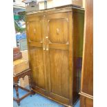 An Oak finish double-doored wardrobe, probably circa 1920.