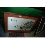 An Oriental embroidered picture on silk of Wading birds.