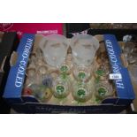 Six green stemmed aperitif glasses, a pair of frosted glass vases,