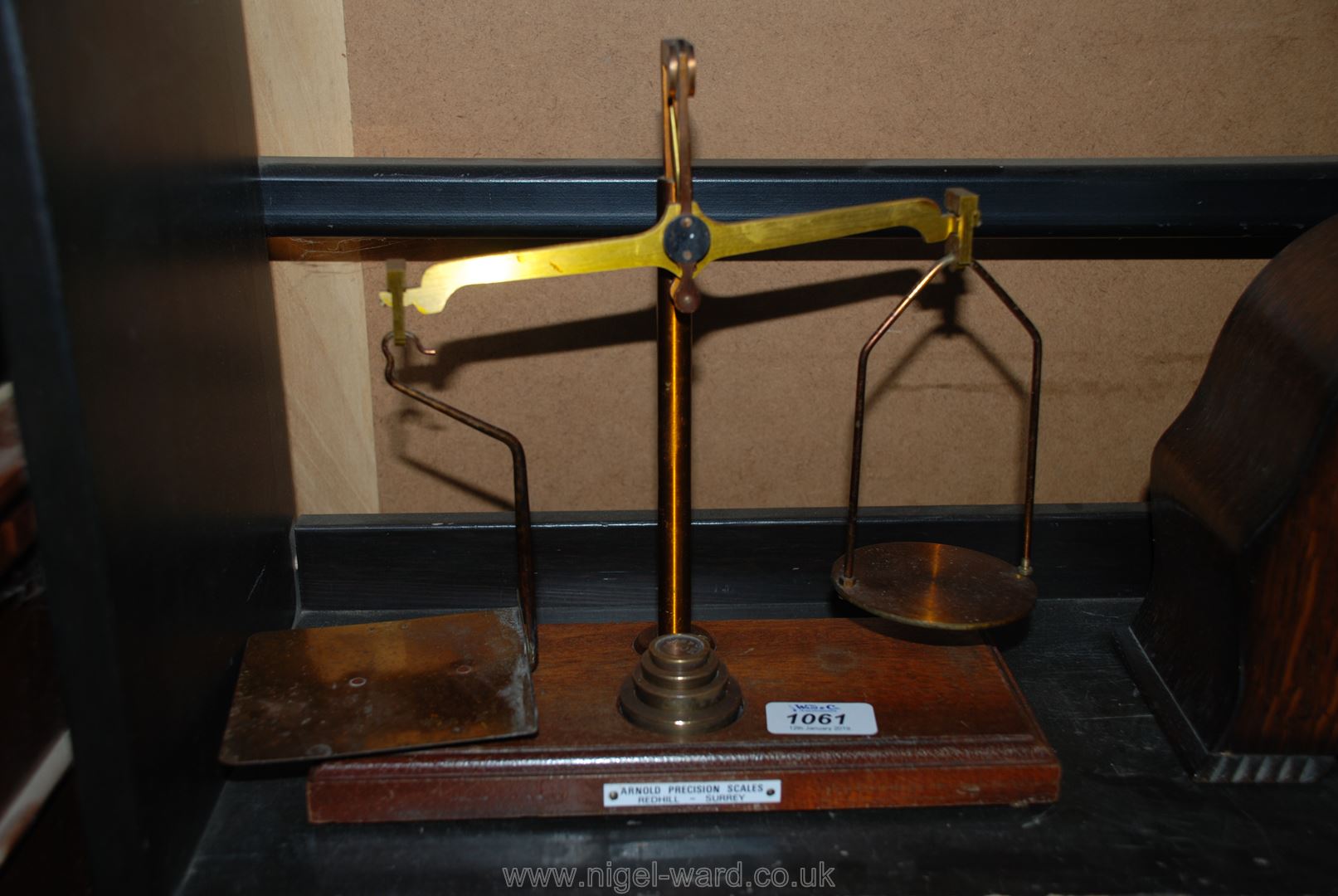 A Mahogany and brass Postal Scales, complete with weights,