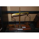 A Mahogany and brass Postal Scales, complete with weights,