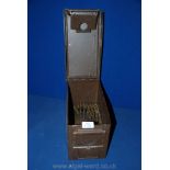 A military ammunitions Box with a string of 55 plus used brass shell cases.