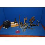An old French Microscope, two other brass microscopes for spares/repair, two bulls eye condensers,