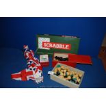 Two carved wooden vintage chess sets with Scrabble game, Union Jack bunting and playing cards.