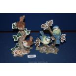 Two Coalport bird figurines including two blue tits sitting on branches,
