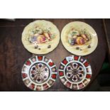Two Aynsley 'Orchard Gold' plates together with two Crown Derby 'Old Imari' plates.