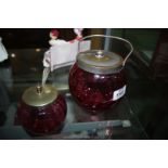 A Cranberry biscuit Jar and marmalade Pot with spoon, both with lids.