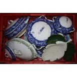 A quantity of blue and white tureens and serving platters, plus a Carlton ware dish.