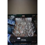 A box of mixed wine glasses and fruit dishes.