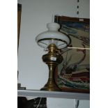 A brass Lamp with glass shade