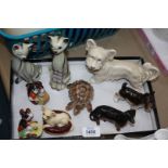 A quantity of animal ornaments including Beswick Dachshund and Chihuahua, Sylvac dog (a/f) etc.