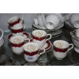 A Royal Worcester coffee set, cream with gold trim pattern,
