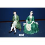 A pair of Royal Doulton figures - Lady and Gentleman from Williamsburg.