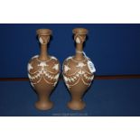 A pair of Royal Doulton siliconware Vases with applied decoration.