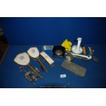 A box of miscellanea including dressing table set, small wooden clock, some calligraphy nibs,