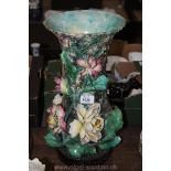 A large Majolica, flower encrusted vase, 16'' tall.