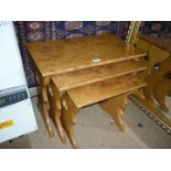 A nest of three well-figured Wych Elm/Ash occasional Tables with fret-worked recesses to the slab