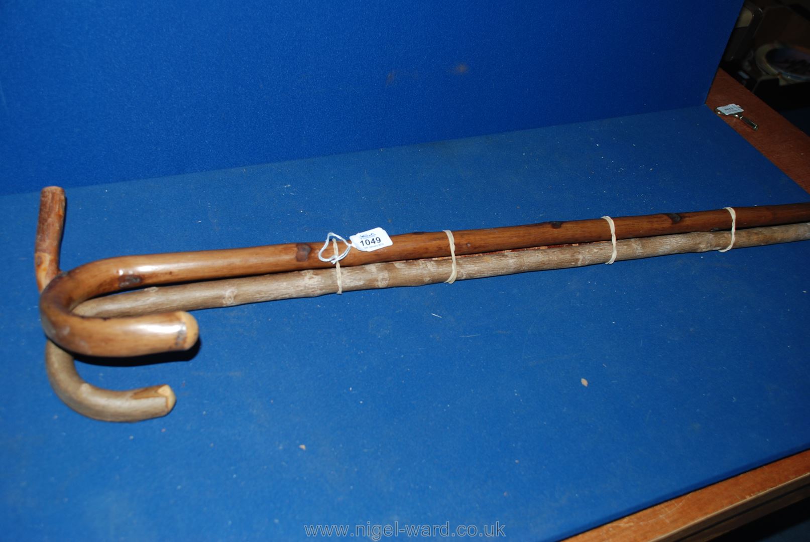 Three Walking Sticks including one with floral carving