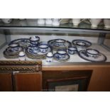 A quantity of Booths 'Real Old Willow' pattern china including dinner, side, and dessert plates,