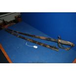A Dress Sword in scabbard, marked "Anderson and Son, St James Street, London". 33" long blade.