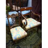 A Regency design curved arm elbow chair with pale yellow ground swirling foliage decorated