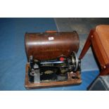 A Singer hand sewing machine,