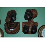 A pair of African carved wall hanging Busts, male and female, Kenya 1960's.