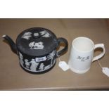 A Wedgwood black basalt Jasperware teapot plus a Keith Murray tankard embossed HCB 1940.