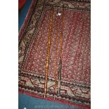 A circa 1900 split cane fly fishing rod with landing net bank stick