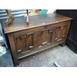 A Jacobean design three panel Oak coffer/blanket Chest of peg-joined construction and with original