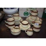 A part Dinner/Teaset in pottery with dinner plates, saucers, cups, tea plates,